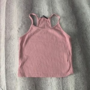 a pink crop tank top that has never been worn